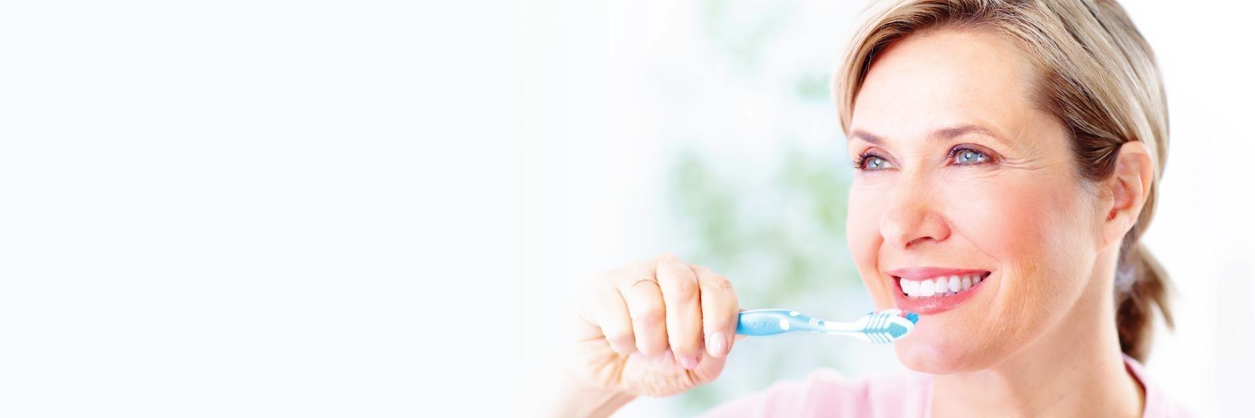 woman brushing teeth | preventative dentistry | chagrin falls oh